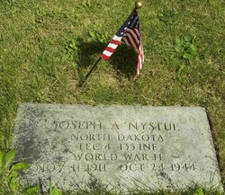 Technician Fourth Grade Joseph A Nystul grave marker with small American flag photo