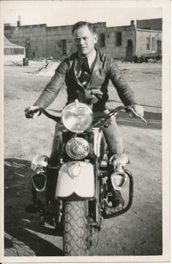 Second Lieutenant Kermit G Sloulin on a motorcycle photo