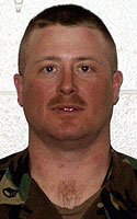 Lance J. Koenig wearing an Army battle dress uniform.