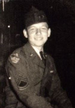 This is a portrait of Lowell Harms is military uniform, seated and smiling. 