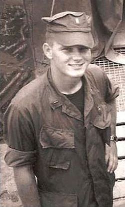 Michael Hendrickson photo The photo of him standing outdoors, smiling warmly at the camera in his military uniform.