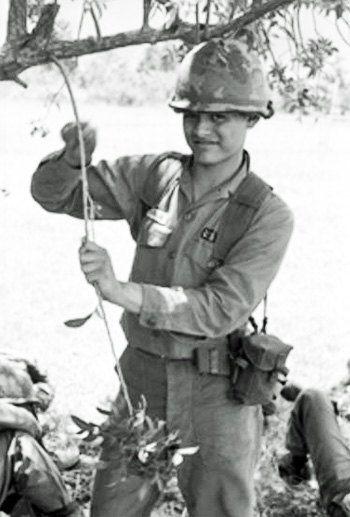 Photo of Michael Villareal outside in duty uniform with helmet