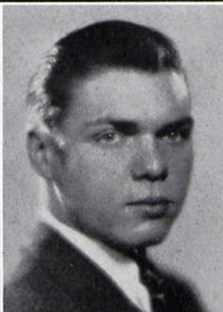 Second Lieutenant Roger A Reynolds in civilian suite and tie head and shoulder photo