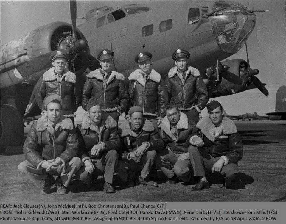 photo of crew standing in from of B17 Aircraft