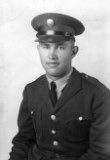 Sergeant Vern H Kickertz in uniform seated photo