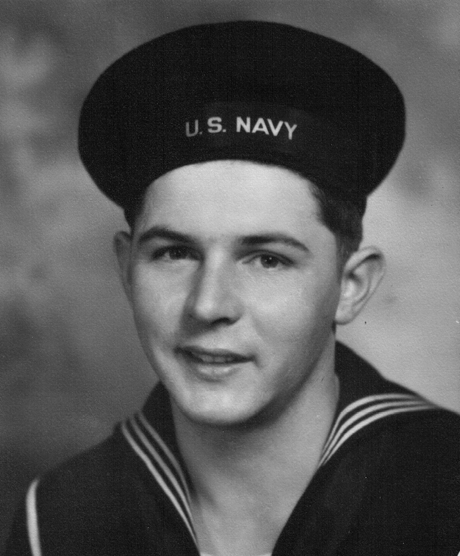 Electrician's Mate Third Class Willie H Korus in uniform head and shoulder photo